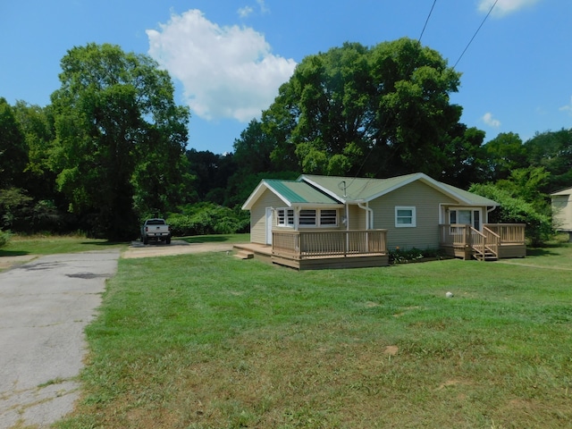 exterior space with a lawn and a deck