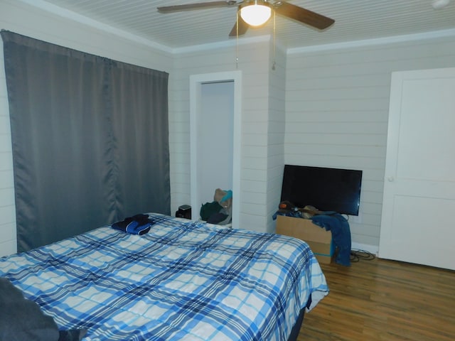 bedroom featuring ceiling fan and dark hardwood / wood-style floors