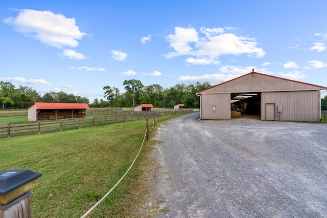 exterior space with a rural view and a yard