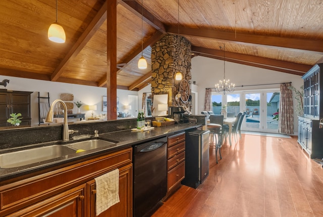 kitchen featuring pendant lighting, black dishwasher, sink, and hardwood / wood-style flooring