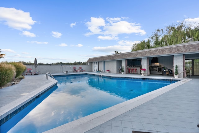 view of pool featuring a patio