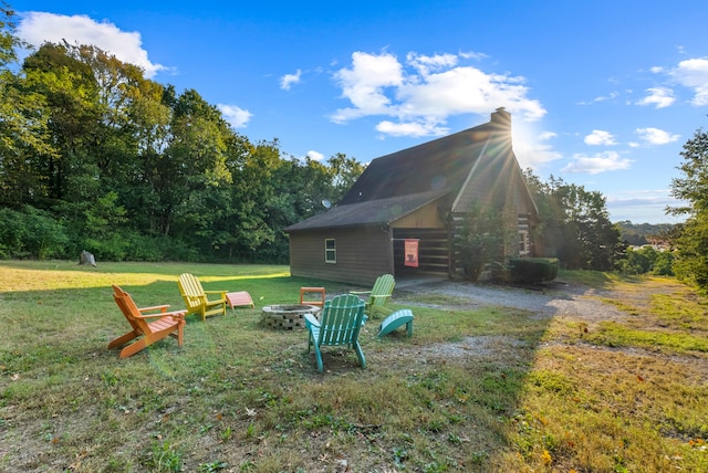 view of yard featuring an outdoor fire pit