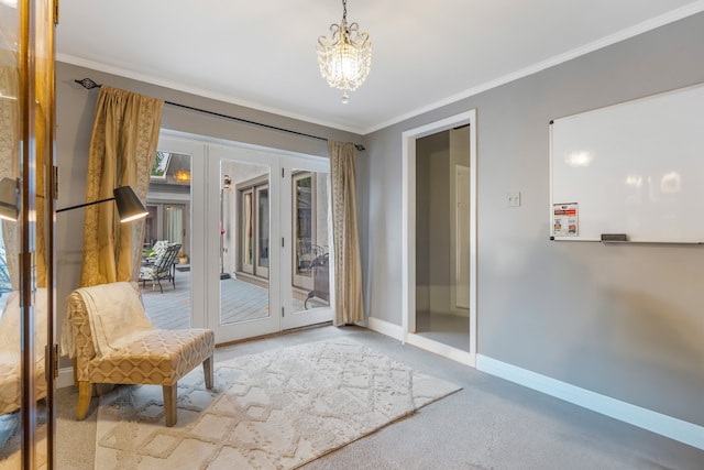 living area featuring crown molding, a chandelier, and light colored carpet