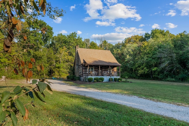 log home with a front lawn