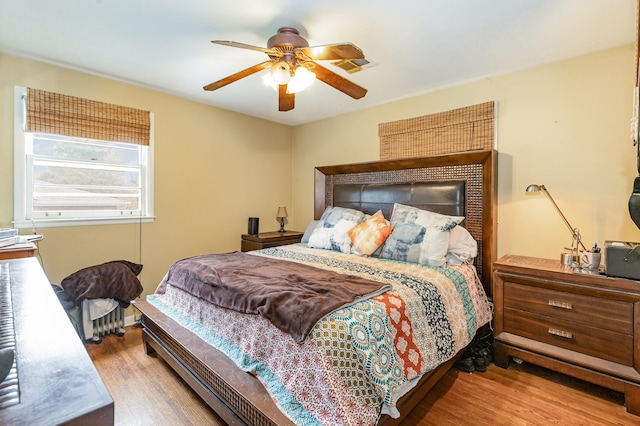 bedroom featuring light hardwood / wood-style flooring and ceiling fan