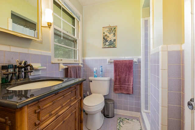 bathroom featuring toilet, a shower with curtain, vanity, and tile walls