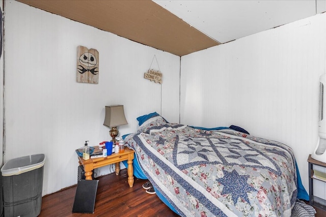 bedroom featuring dark hardwood / wood-style flooring