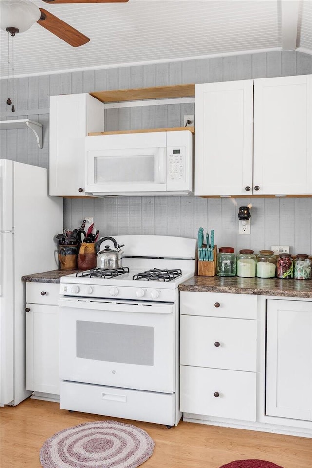 kitchen featuring white cabinets, white appliances, light hardwood / wood-style floors, and ceiling fan