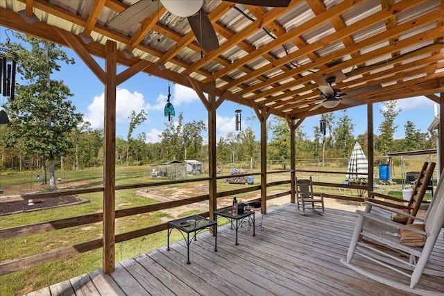 deck featuring a lawn and ceiling fan