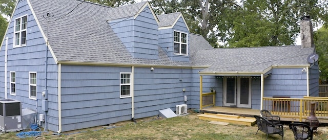 rear view of house featuring a deck