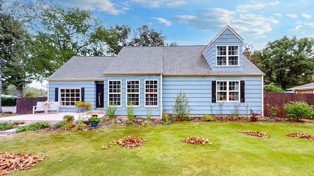 view of front of property with a front yard and a patio area