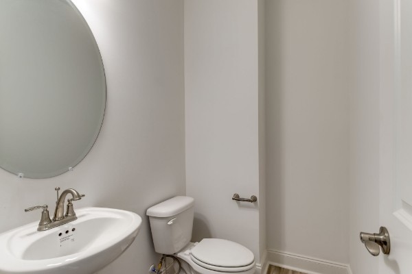 bathroom featuring sink and toilet