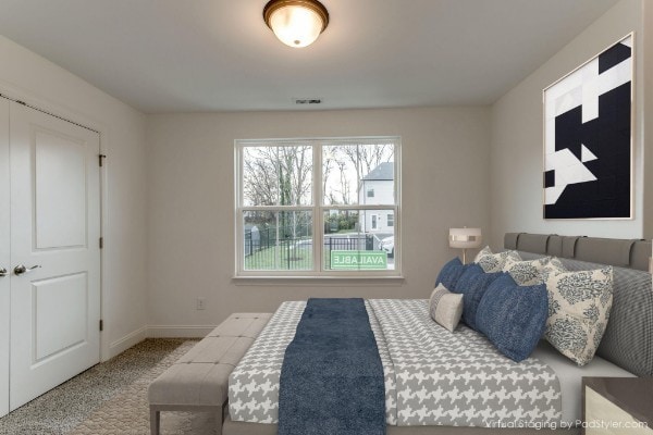 bedroom with carpet and a closet