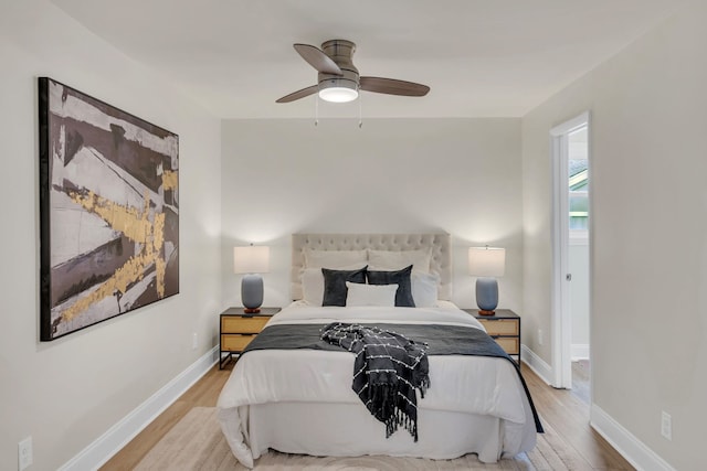 bedroom featuring light hardwood / wood-style floors and ceiling fan