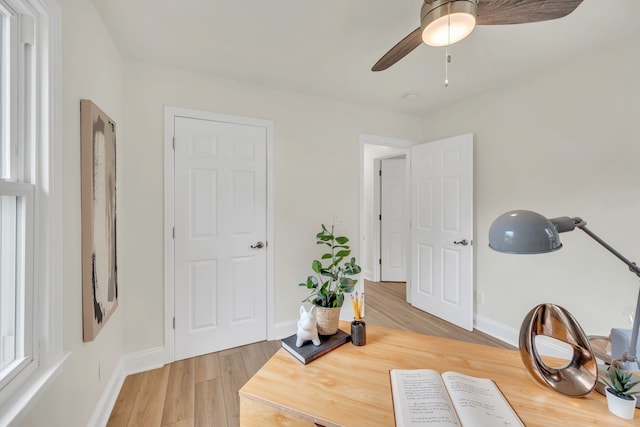 miscellaneous room featuring ceiling fan and hardwood / wood-style floors