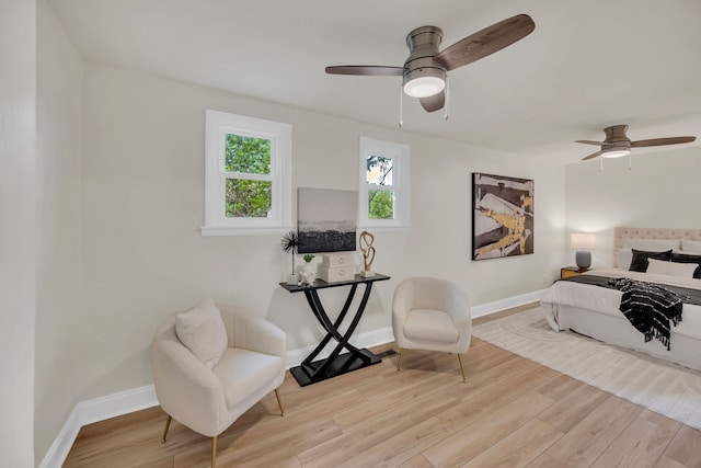 bedroom with ceiling fan and light hardwood / wood-style flooring