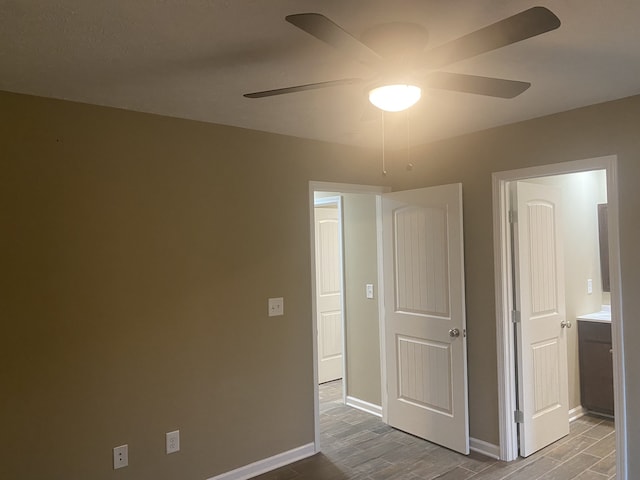 interior space with ceiling fan and wood-type flooring