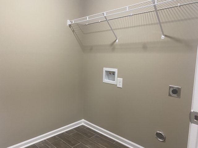 laundry area featuring hookup for a washing machine, dark wood-type flooring, and hookup for an electric dryer