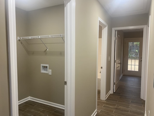 clothes washing area featuring washer hookup and dark hardwood / wood-style flooring