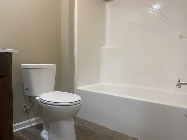 full bathroom with wood-type flooring, vanity, toilet, and  shower combination