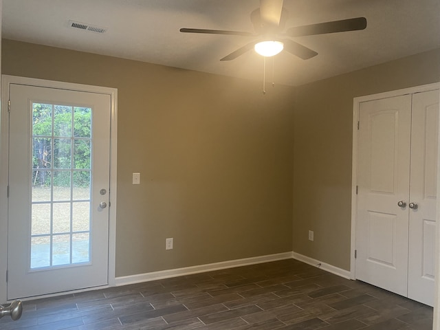 entryway with ceiling fan and dark hardwood / wood-style flooring