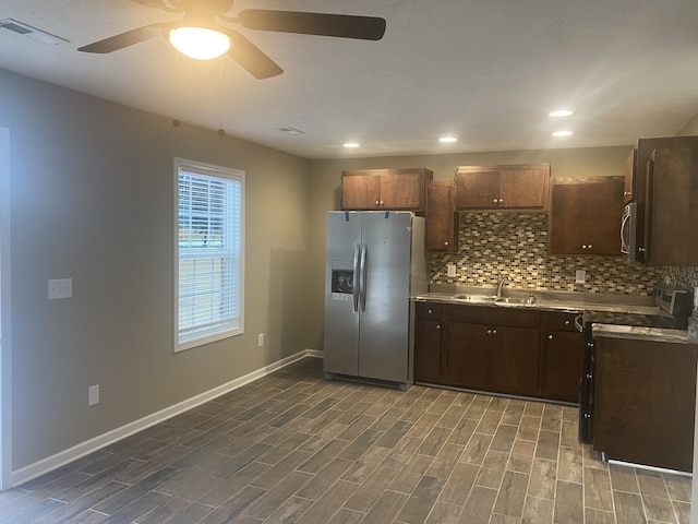 kitchen with dark hardwood / wood-style floors, ceiling fan, stainless steel appliances, and sink