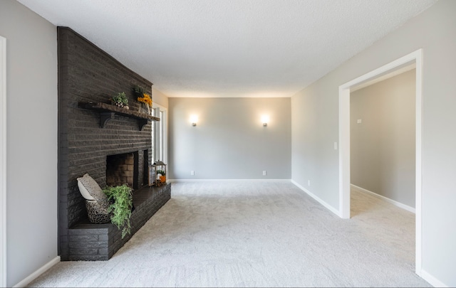 living room featuring light carpet, a textured ceiling, and a fireplace