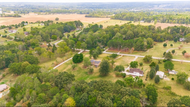 birds eye view of property with a rural view