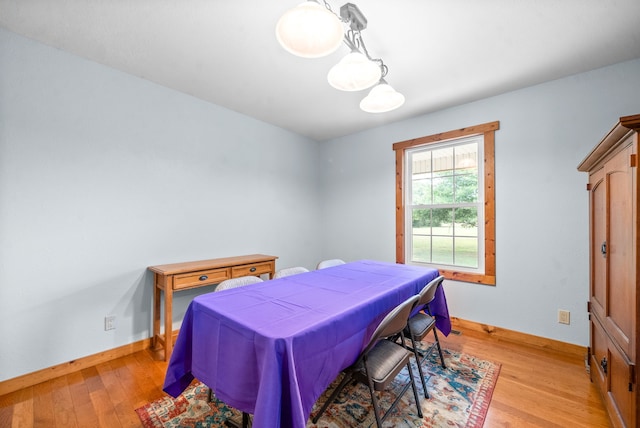 dining area with light hardwood / wood-style floors