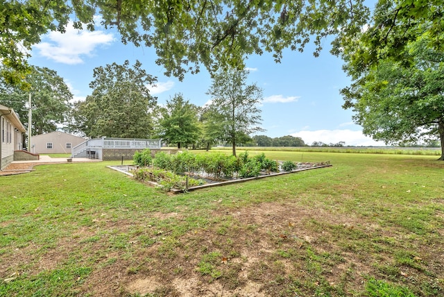 view of yard with a rural view and glass enclosure