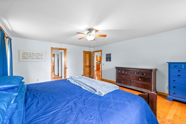 bedroom featuring ceiling fan and light hardwood / wood-style floors