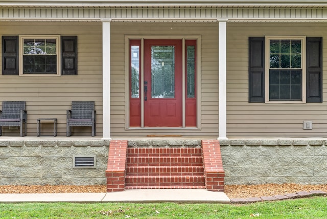 doorway to property with a porch