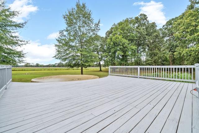 wooden terrace with a yard