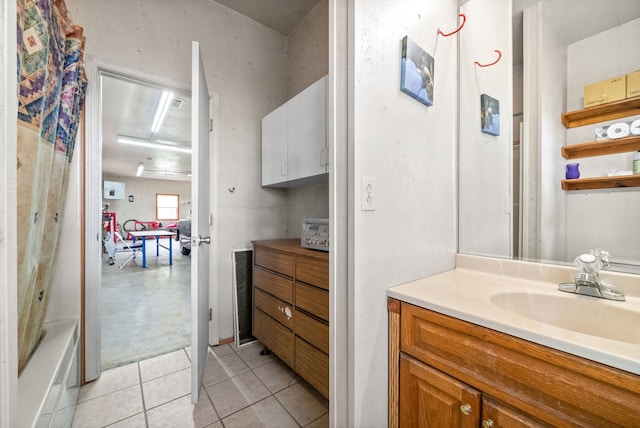 bathroom featuring shower / tub combo, vanity, and tile patterned floors