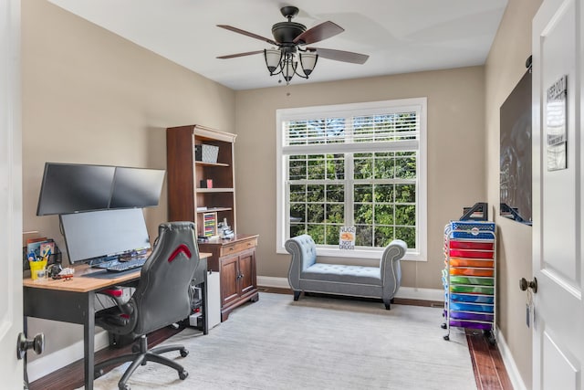 office area with ceiling fan and light hardwood / wood-style flooring