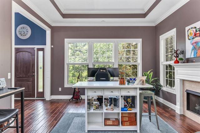 office with crown molding, a healthy amount of sunlight, and dark hardwood / wood-style flooring