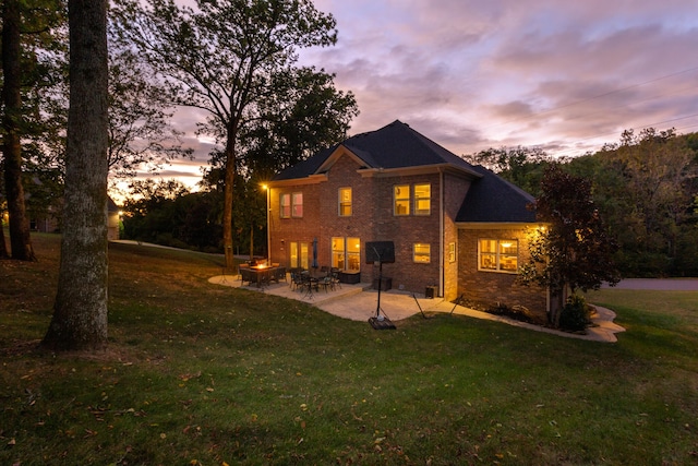 exterior space featuring a lawn and a patio area