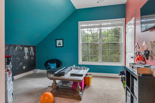 game room with vaulted ceiling and carpet flooring