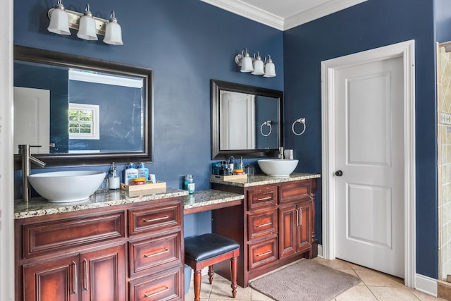 bathroom with tile patterned flooring, ornamental molding, and vanity