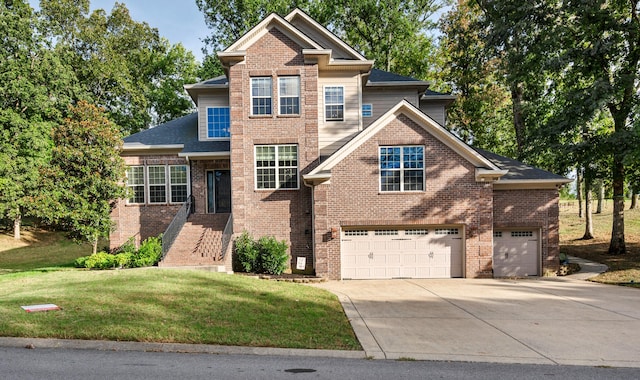 craftsman house with a garage and a front lawn