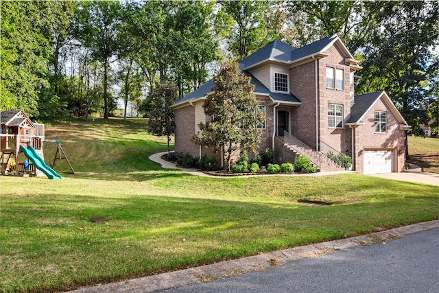 exterior space with a playground, a garage, and a front yard