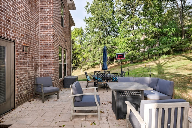 view of patio / terrace featuring an outdoor living space with a fire pit