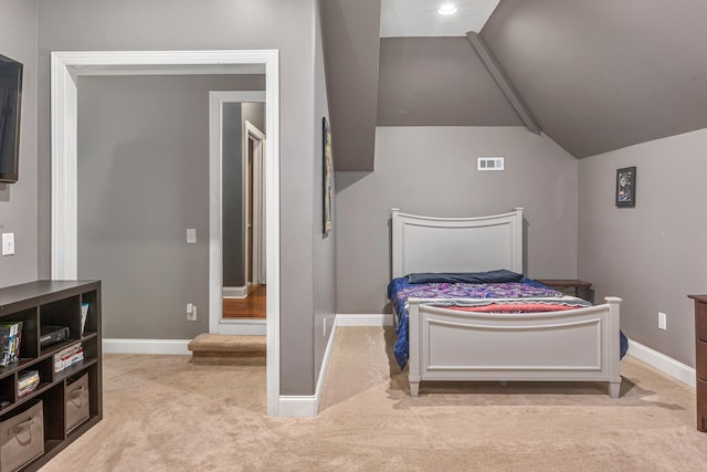 carpeted bedroom featuring lofted ceiling