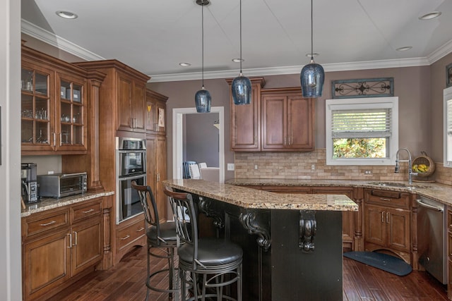 kitchen featuring dark hardwood / wood-style flooring, decorative backsplash, appliances with stainless steel finishes, and sink