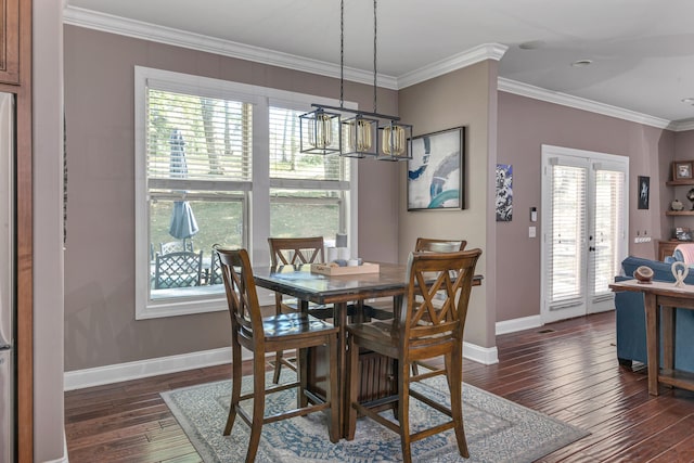 dining space with crown molding, dark wood-type flooring, french doors, and a notable chandelier