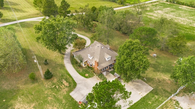 birds eye view of property with a rural view