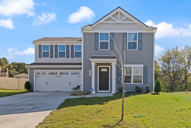 view of front of property with a garage and a front lawn