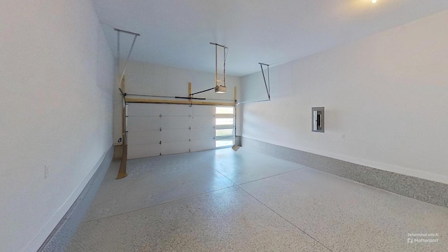 657 Gustaf Dr, Whites Creek, TN 37189 - garage with a garage door opener, electric panel, and baseboards