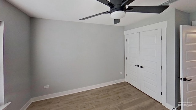 661 Gustaf Dr, Whites Creek, TN 37189 - unfurnished bedroom with wood finished floors, a closet, baseboards, and a ceiling fan