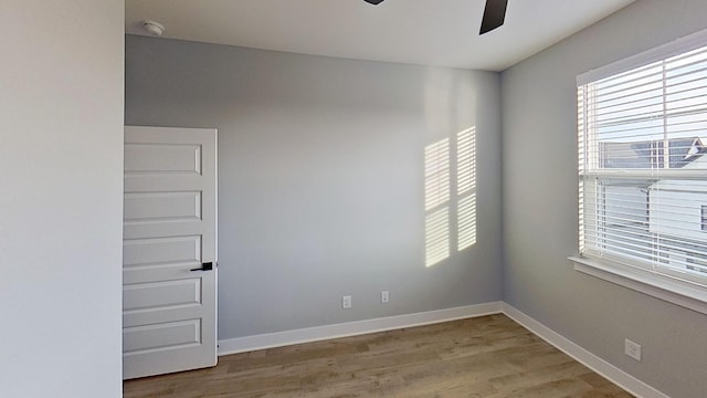 661 Gustaf Dr, Whites Creek, TN 37189 - empty room with a ceiling fan, wood finished floors, a smoke detector, and baseboards